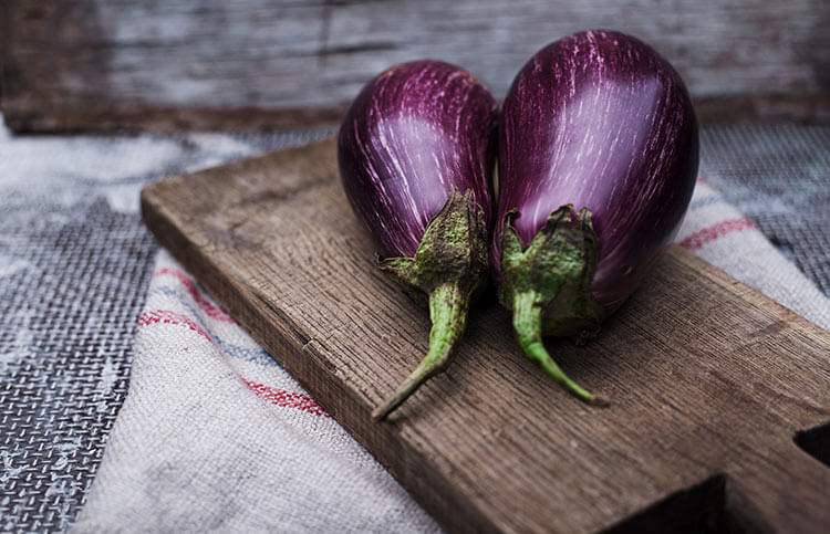 eggplant on wooden cutting board