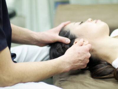 photo of person receiving ear acupressure massage