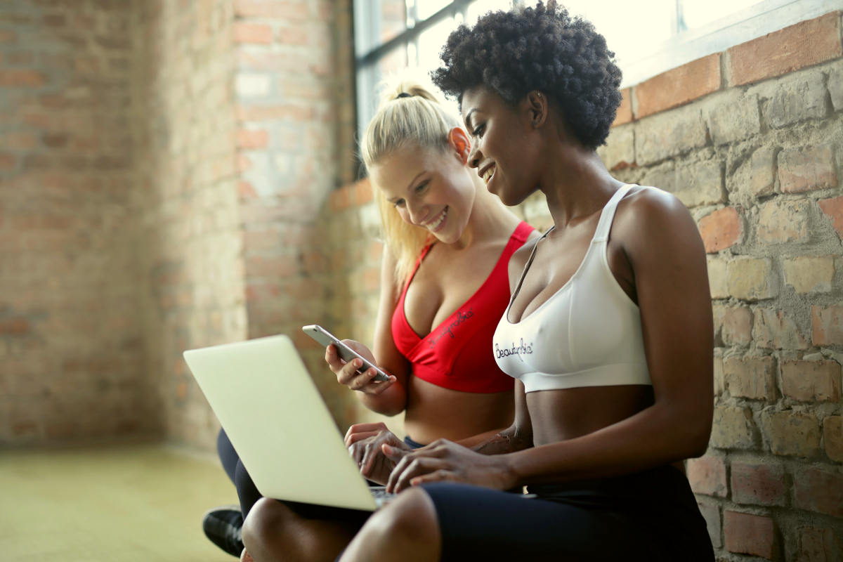 Two woman wearing sports bra 