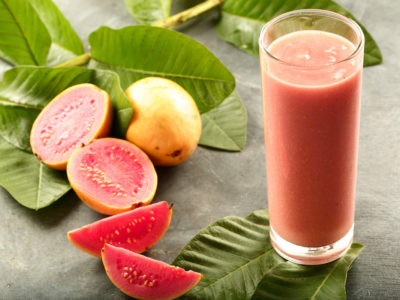 photo of cut up guava and glass of guava juice