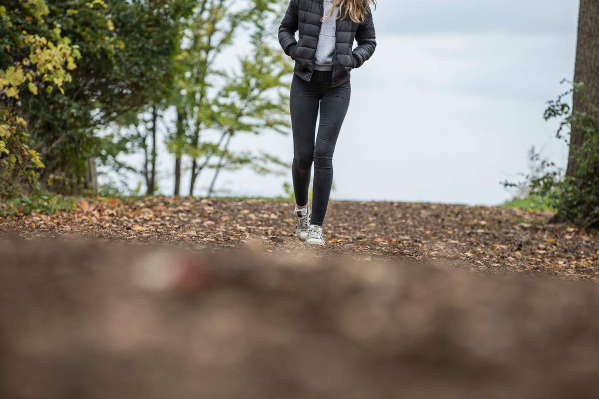 woman in black walking in park | Can't Focus? 11 Ways To Improve Your Concentration Naturally | how to improve your focus