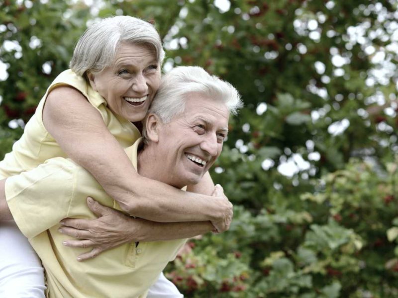 Happy elderly couple spending time outdoors
