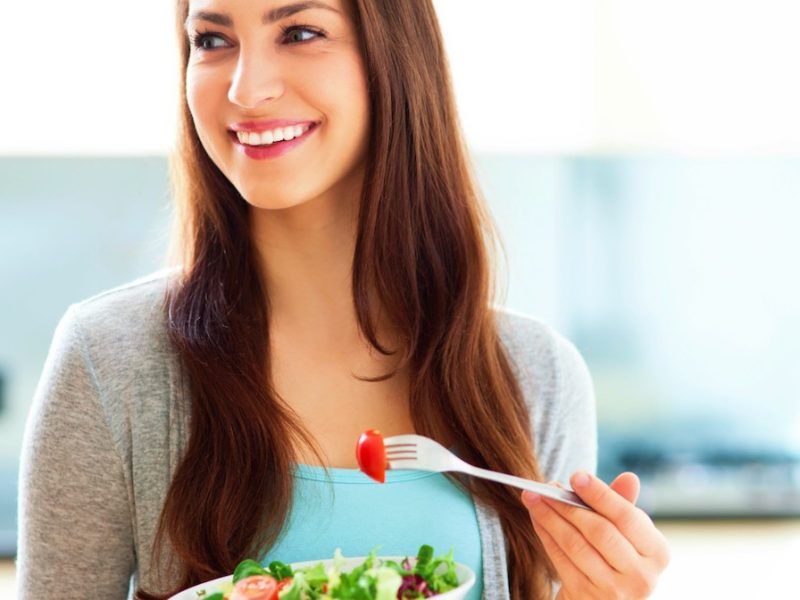 photo of woman eating salad for intermittent fasting