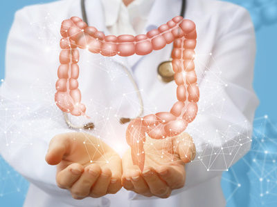 doctor holding hologram of a colon