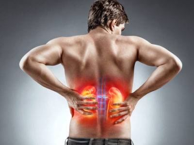 Kidneys pain. Man holding his back. Medical concept.