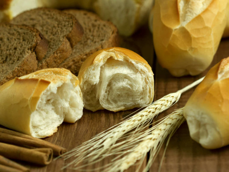 A variety of bread sits on a table