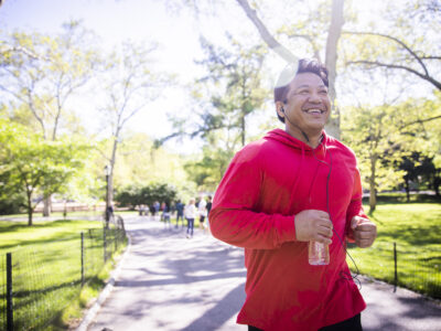 photo of older man jogging in park; men's health concept