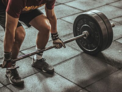 photo of man lifting weights for strength training
