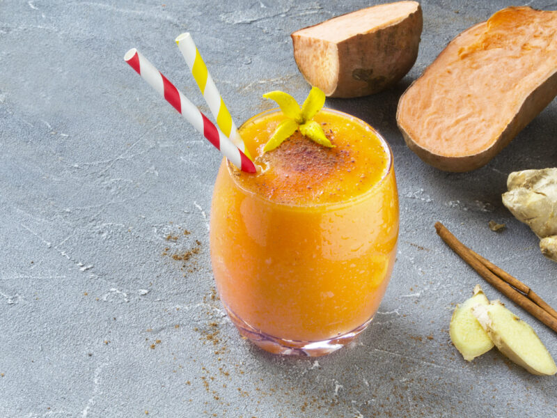 Sweet Potato Smoothie with Cinnamon and ginger on a grey background. 